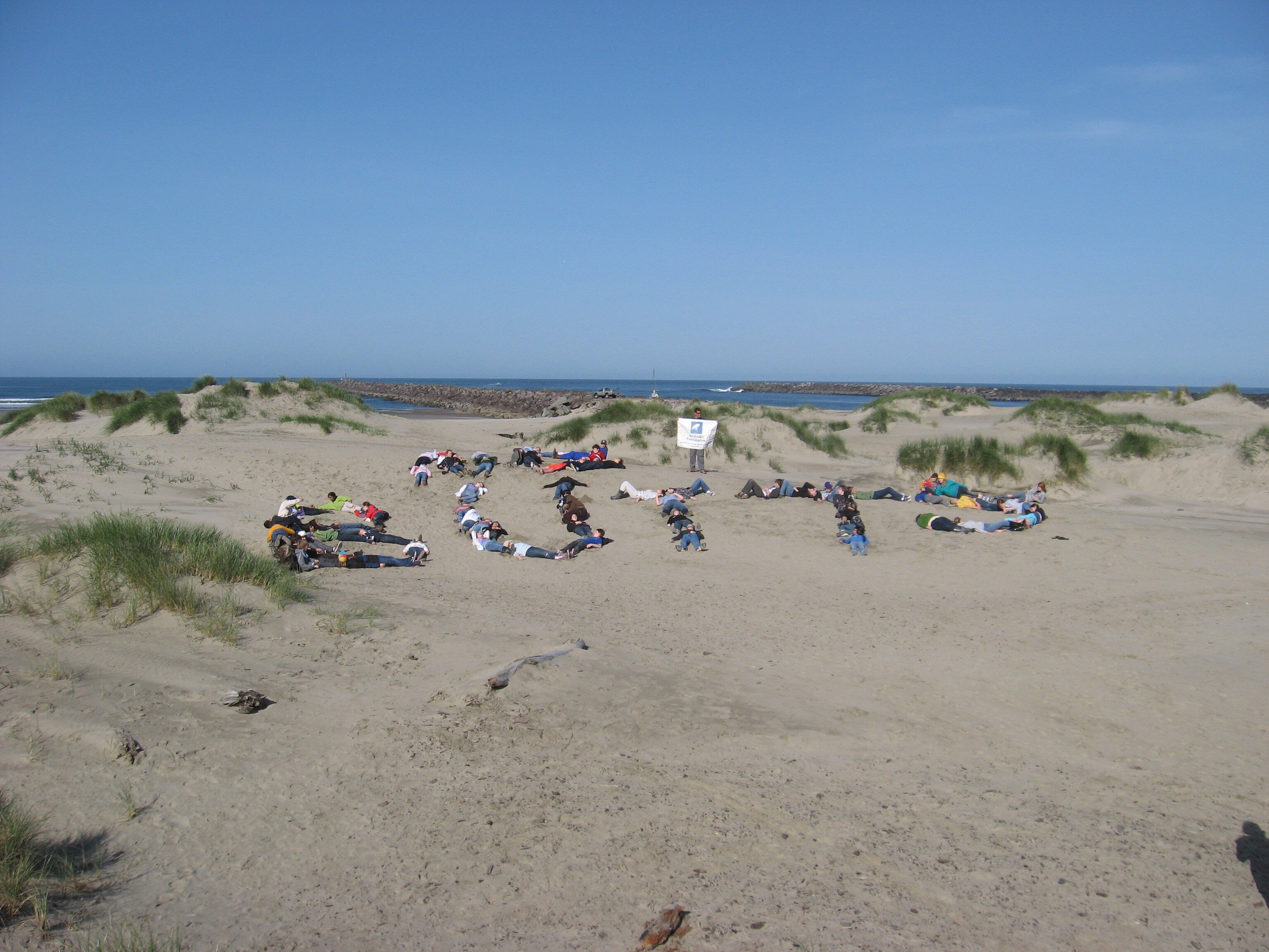 Westside Village Magnet Students spell out "No Butts" on beach